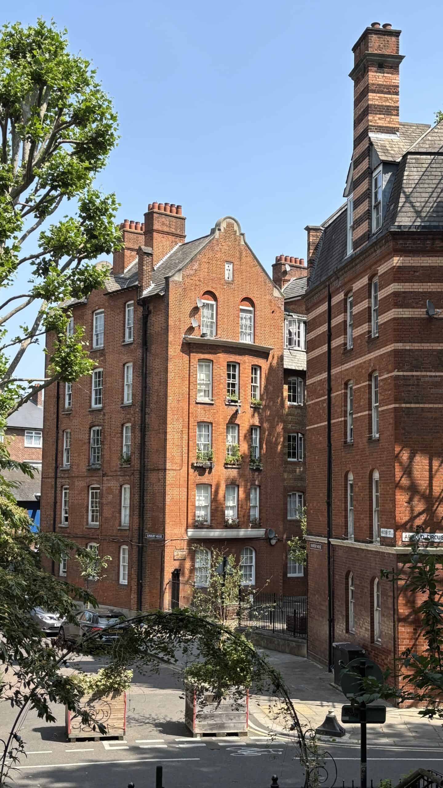The Boundary Estate in Shoreditch, London, showcasing historic red-brick buildings and Victorian architecture