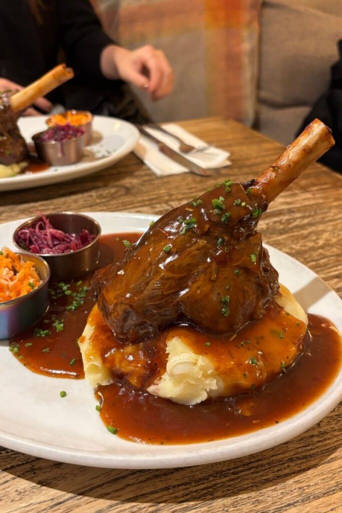 Dish of lamb shank and mash served on a white plate from Makers Mash Bar in Edinburgh