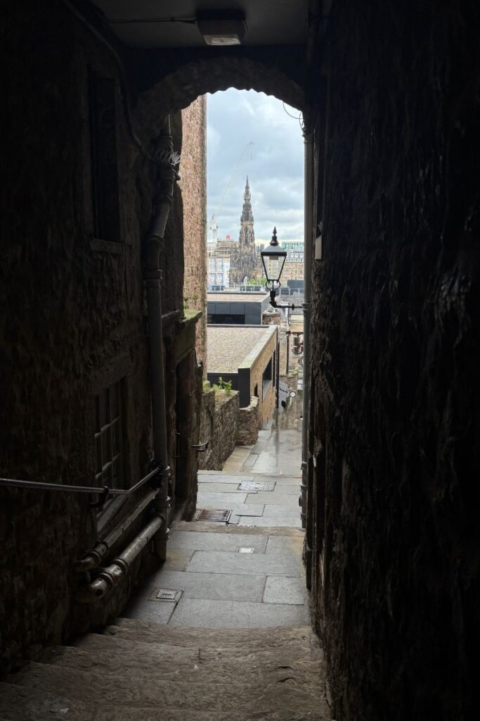 Advocates Close in Edinburgh with Scott Monument is distance.
