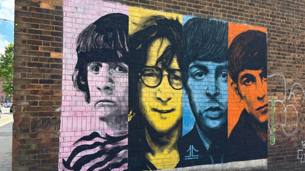Colorful street art depicting The Beatles in Liverpool's Baltic Triangle District