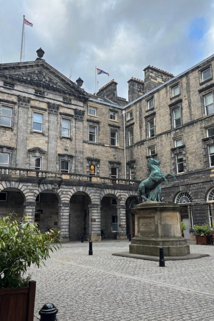 Exterior of City Chambers in Old Town Edinburgh, showing historic architecture and stone facade.