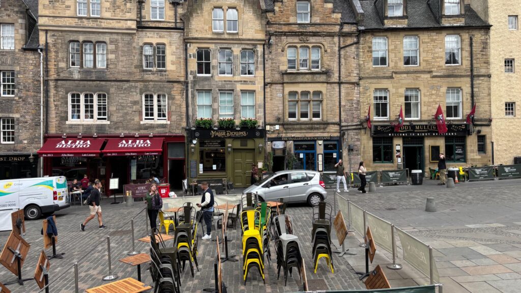 Mary Dickens pub in Grassmarket, Old Town Edinburgh with historic stone facade and outdoor seating.