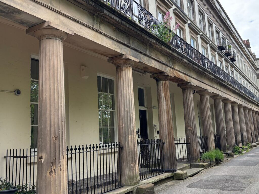 Victorian and Georgian classic architecture featuring columns and balconies along historic Gambier Terrace in Liverpool's Georgian Quarter.