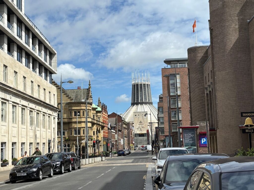 Streetscape of Hope Street in Liverpool's Georgian Quarter looking north towards the grey, modernist Metropolitan Cathedral with Georgian Buildings on either side.