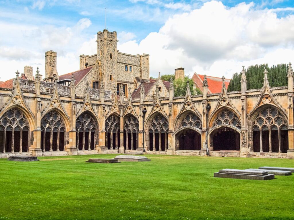 Canterbury Cathedral Cloisters with arches in front of green space