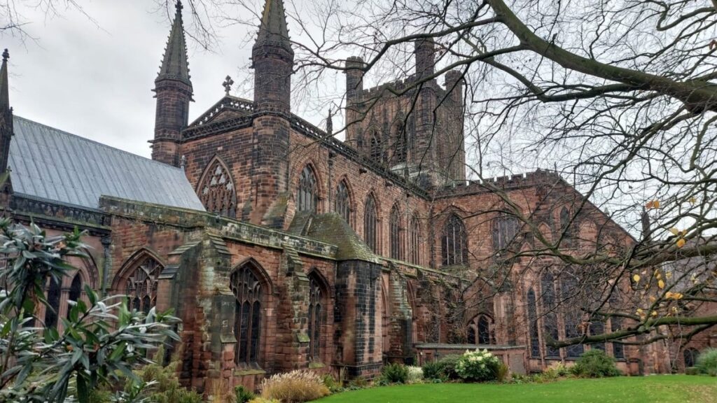 Chester Cathedral’s brown sandstone exterior on a winter day in Chester, England.
