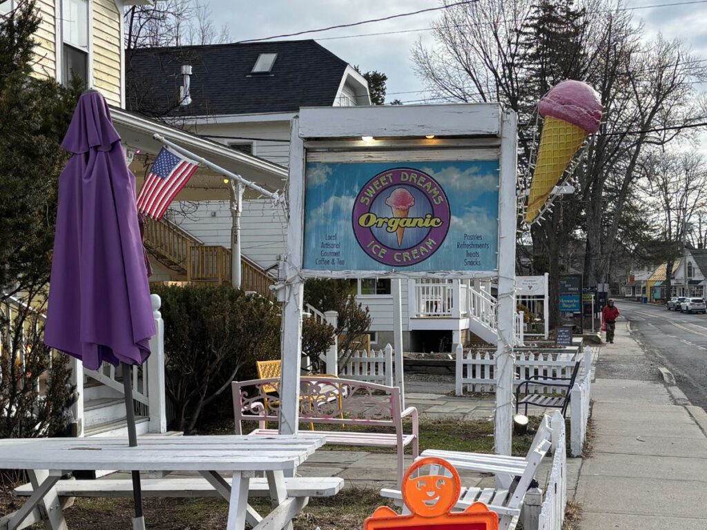 View looking west to east down Tinker Street past an ice cream store, Woodstock, NY