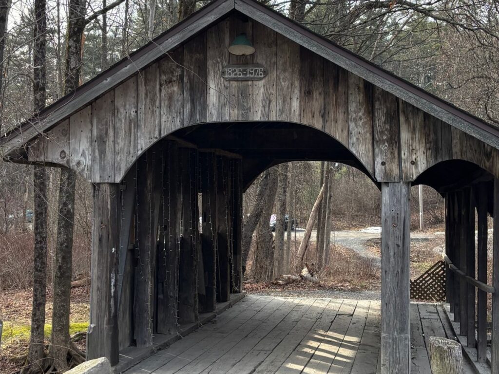 Wooden public covered bridge over the Mill Stream in Worrdstock, NY built in 1976. Located off Tinker Street.