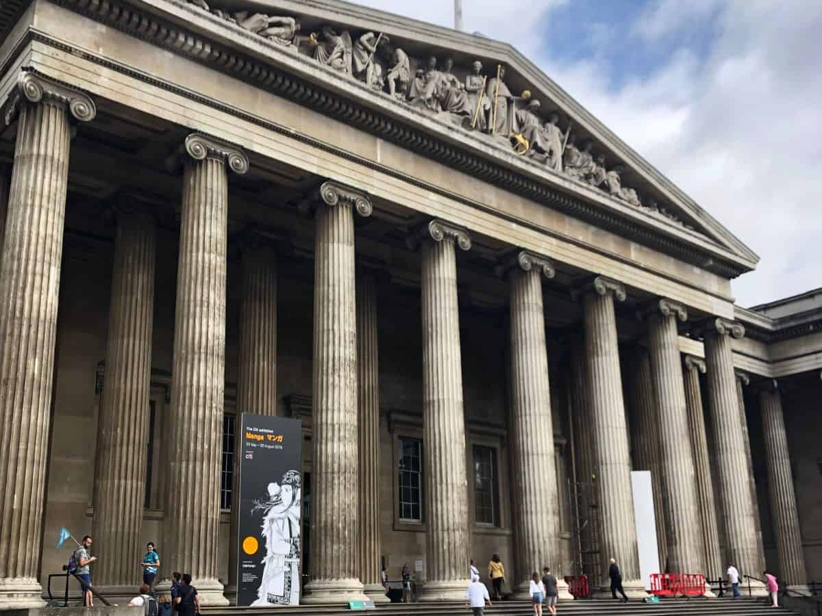 Entrance to The British Museum in London with it's Greek Revival architecture on display including it's many scroll top vertical columns.