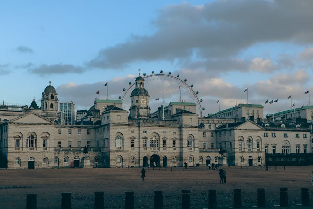 Captivating view of Horse Guards Parade and London Eye under a blue sky in London.