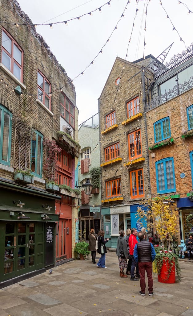 Explore the colorful and lively atmosphere of Neal's Yard, a hidden gem in Covent Garden, London.