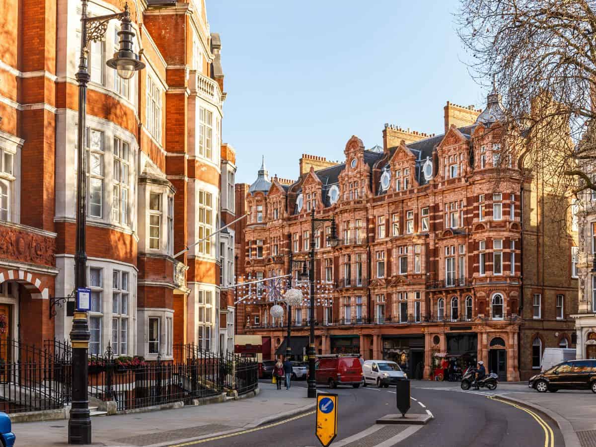 Classic red brick architecture display in a streetscape in the district of Mayfair, London