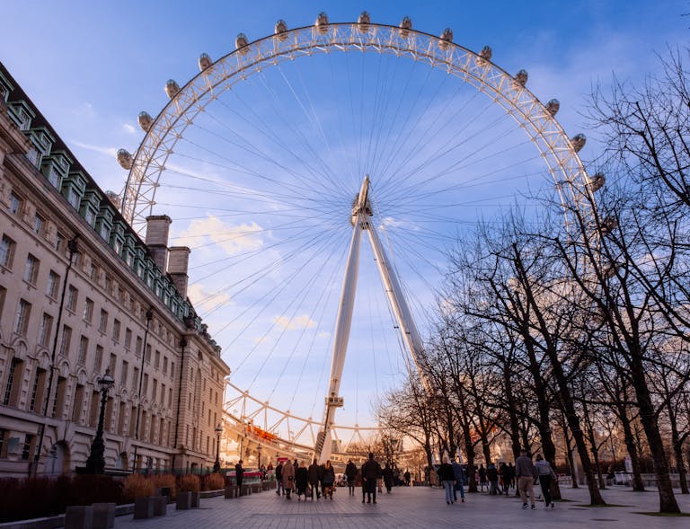 Stunning capture of the London Eye with a backdrop of blue skies, highlighting its grandeur.